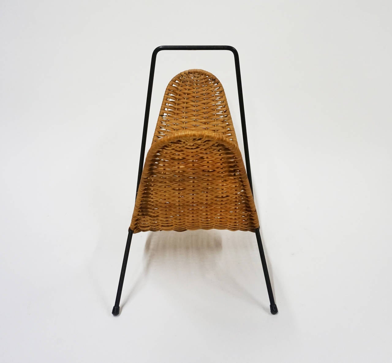 Iron and woven reed magazine rack by Laurids Lonborg of Denmark.