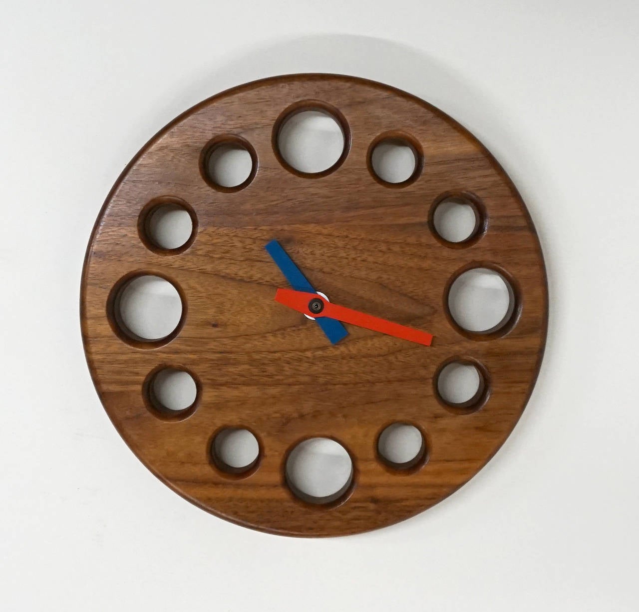 1960s handcrafted solid walnut clock with metal red and blue hands.