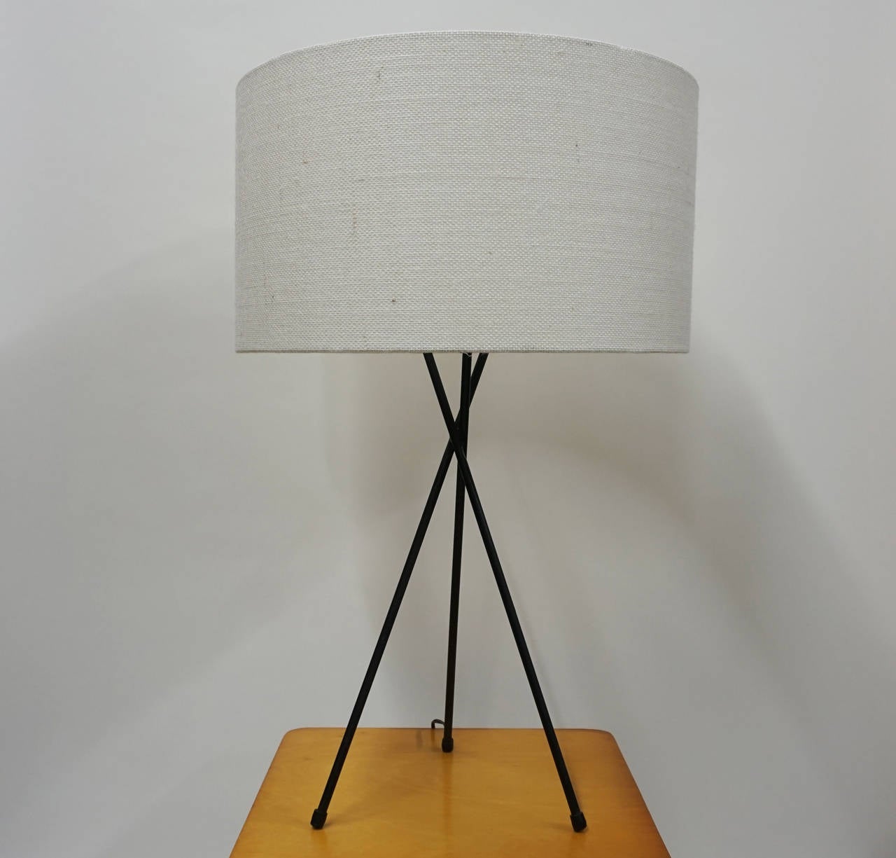 Sculptural iron table lamp from the 1950s. The lamp can be seen in photos promoting the early 1950s Pacifica design movement. 

New lampshade is 18