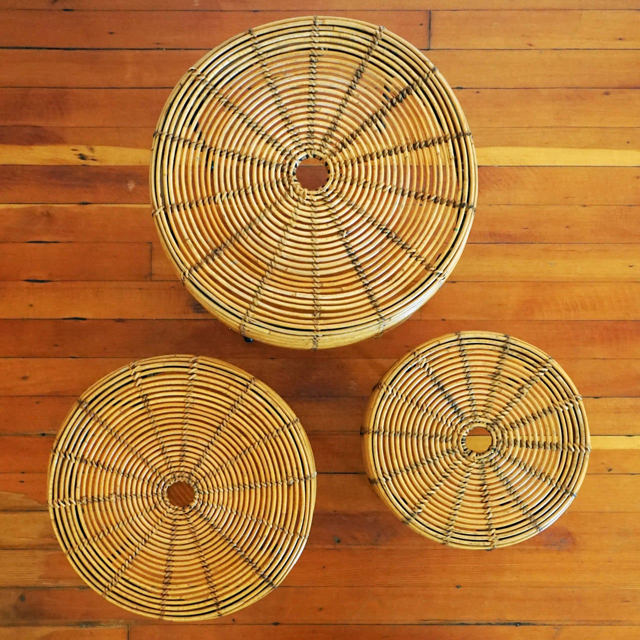 Set of three wicker and iron nesting tables from 1953 by John Risley, (1919-2002). 

Dimensions:

21