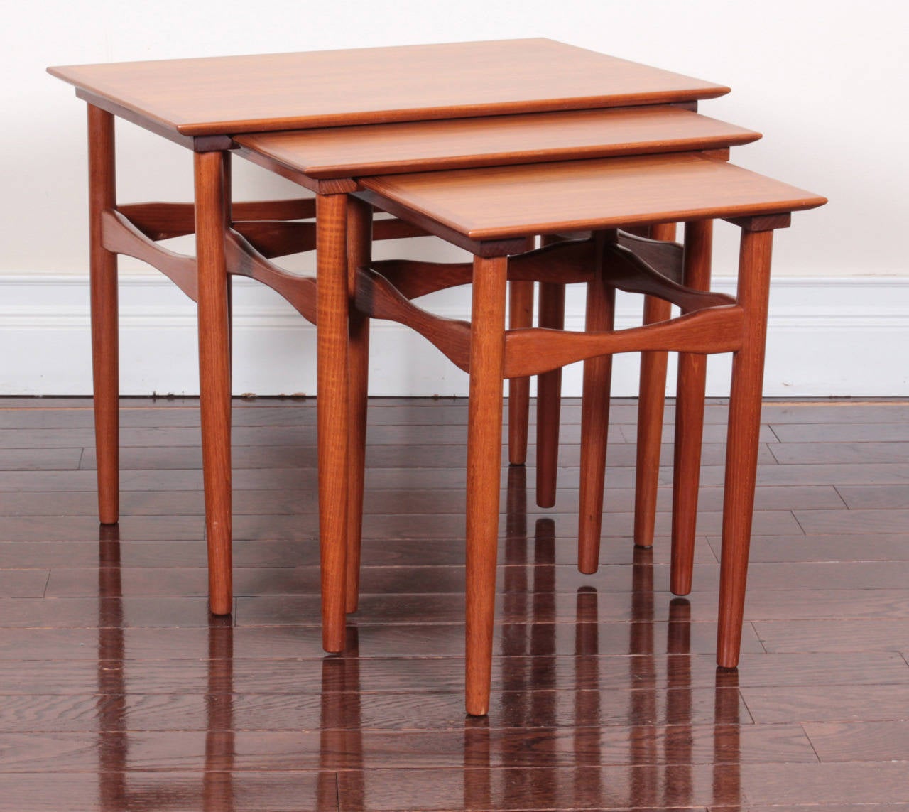 Comprising three tables of graduated size, each table with rectangular top raised on turned tapering legs. Dimensions below are for largest table. Stamped: Fabian.