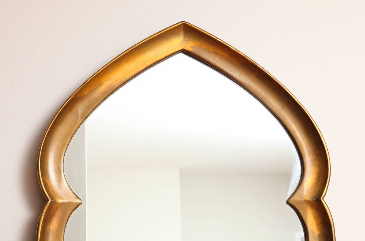 A Mid-Century Modern gilt mirror in arabesque form by La Barge.