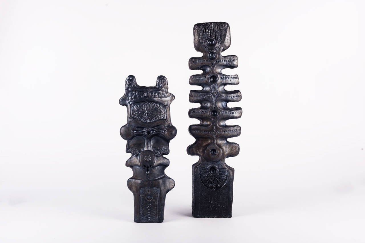Pottery totems by Elisabeth Vandeweghe for Perignem, Belgium. Made in the early 1970s. Clay in Perignem's signature black doré glaze (red clay, dark glaze). Rich variations of tone and a fine iridescence. These sculptures are exceptional in form