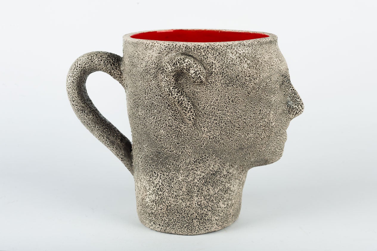 Ceramic head goblet by Francis Triay (France, 1927-2013), early 1970s, signed. Handmade clay pottery with textured exterior and bright red glaze interior. Fine and delicate details, a sign of Triay's best work. Acquired from a descendant of the