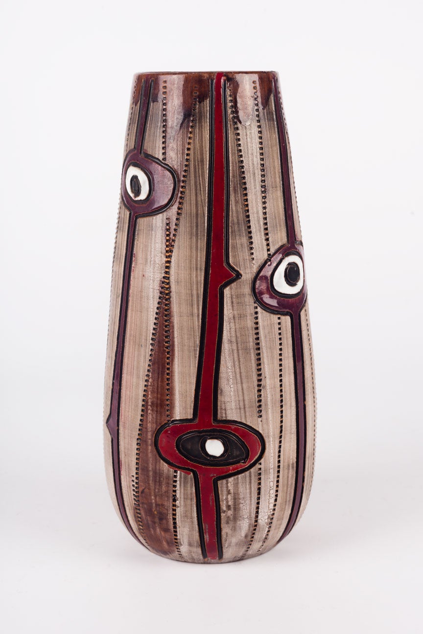 Vase made in 1960s in Italy by Fratelli Fanciullacci for Raymor USA. Hand-painted ceramic in neutral earth tones, dark and light browns, beige, and also deep red and white. Partial glaze and eyes motif.

The American company Raymor,  active from