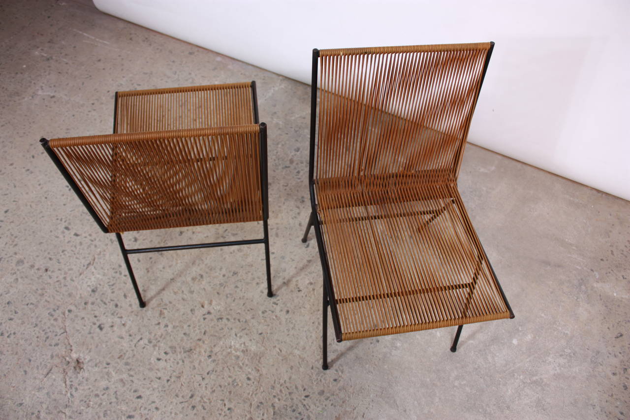 This pair of Allan Gould silk wrapped string chairs is in excellent, vintage condition displaying minor-age appropriate wear to the string (slight fading). The string is original and has not been replaced.