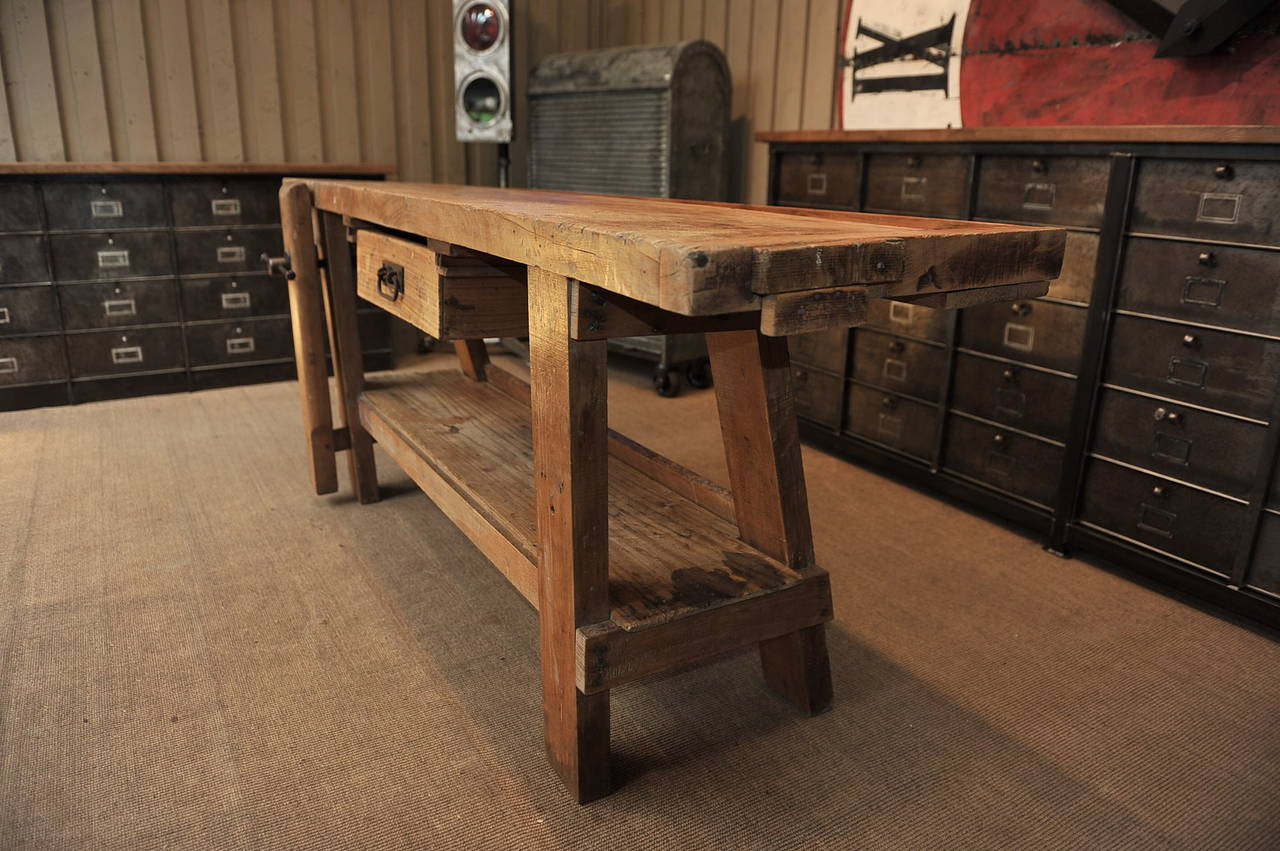 French Carpenter's work Bench  circa 1920 lade in beech wood ,and pine wood for the lower shelf and tool area . it was restaured and waxed ready to use as a console table. the Iron polished and varnished vise works very easily.
 Depth without vise: