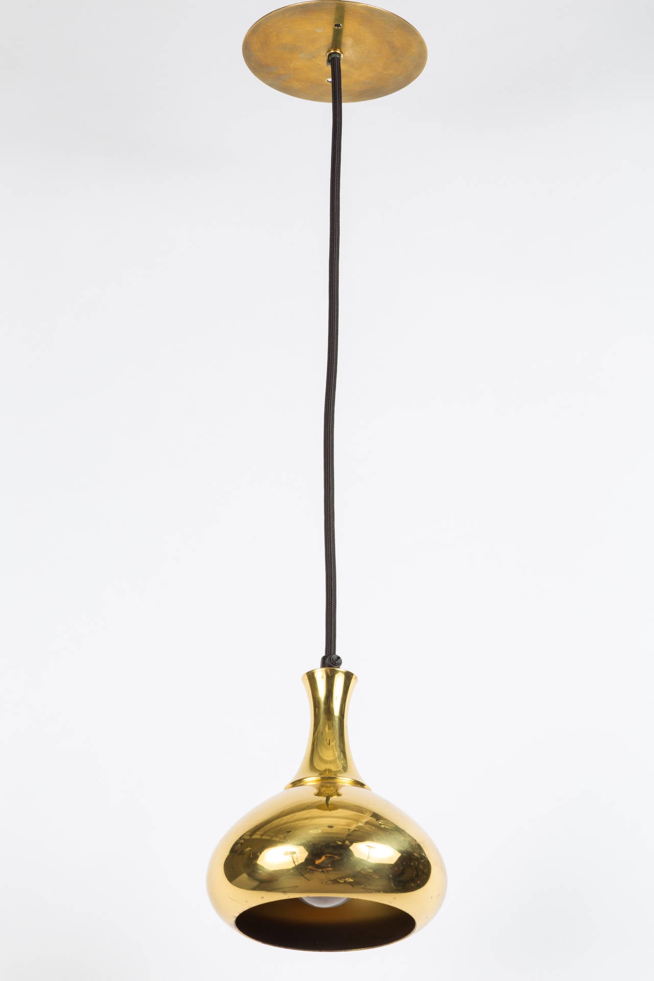 1950s Hans-Agne Jakobsson brass pendant for Markaryd, Sweden. Simple curves and pleasing brass patina. Height is readily adjustable to desired length.