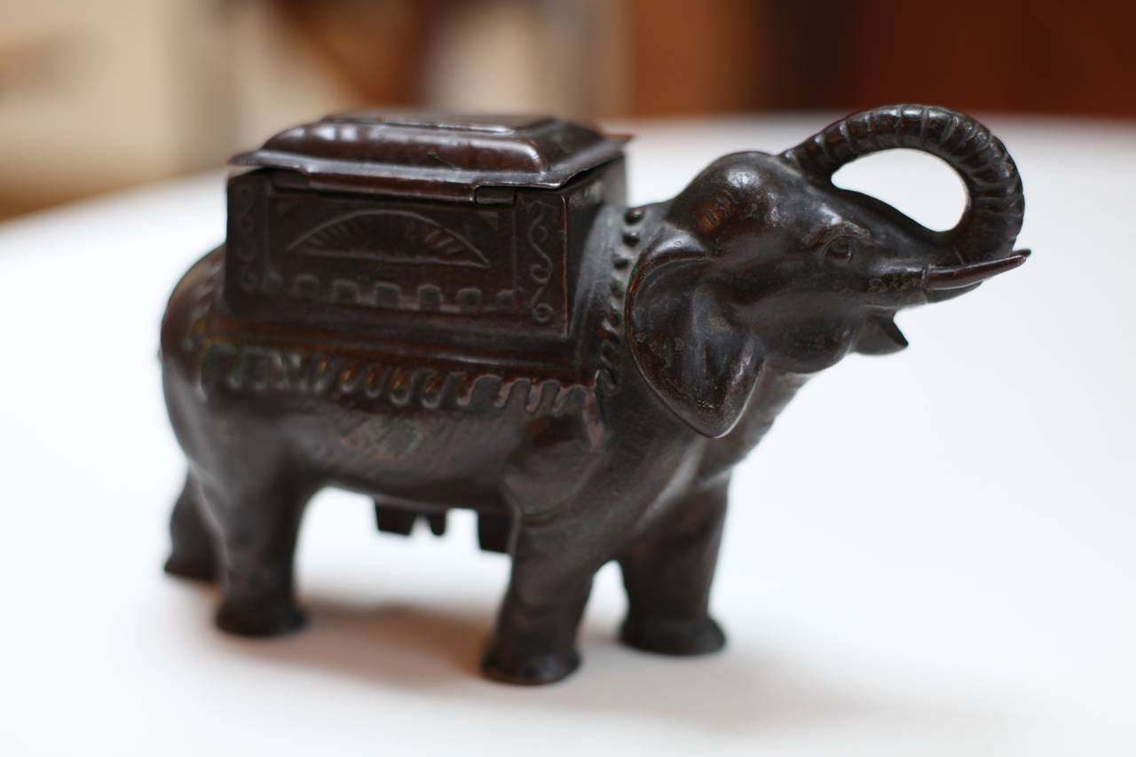 Lovely Victorian India elephant cigarette dispenser with rotating tail to dispense cigarettes in the under belly catch.