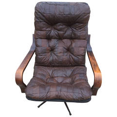 Leather and Walnut Swivel Recliner