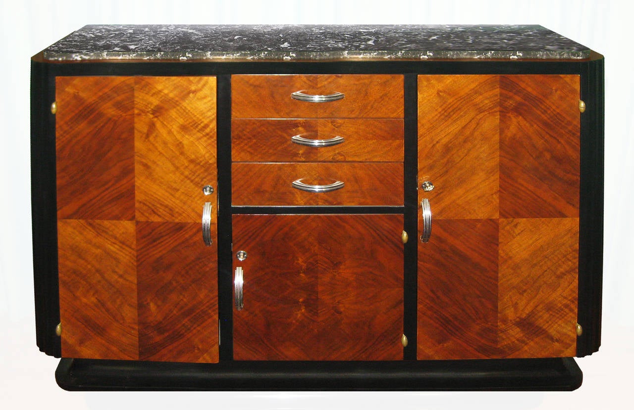 Paris sideboard--ALL ORIGINAL--with mahogany veneer, black lacquer trim and chrome hardware; marquetry on the banks of the drawers; all locks work perfectly; topped with black Marquina marble.  Interior lacquered green with felt.  Noble, elegant