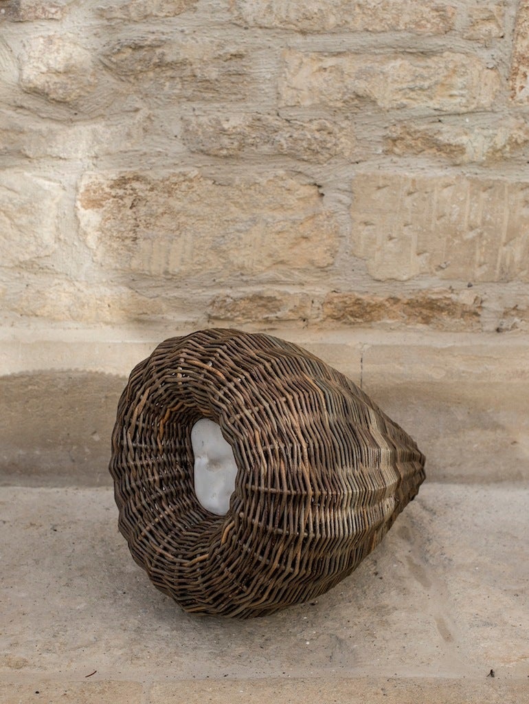 sculptural basket with white rippled stone 

by Joe Hogan Irish basket maker

willow with rippled white stone woven into the pod

31 x 48 x 45 cm
12 1/4