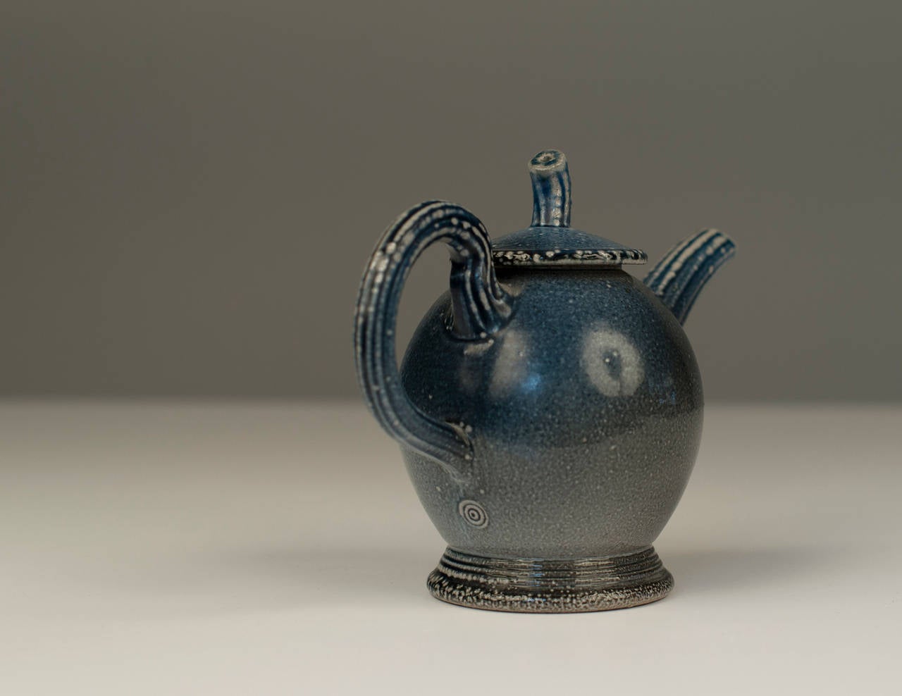 Stoneware, salt glazed teapot with potters mark underneath the handle. Made by Walter Keeler

14.5 cm tall (6