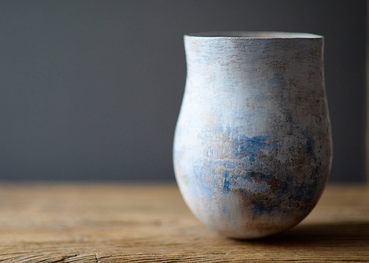 Hand formed and pinched mottled blue earthenware jar by Elspeth Owen

14 x 20 cm (5 1/2