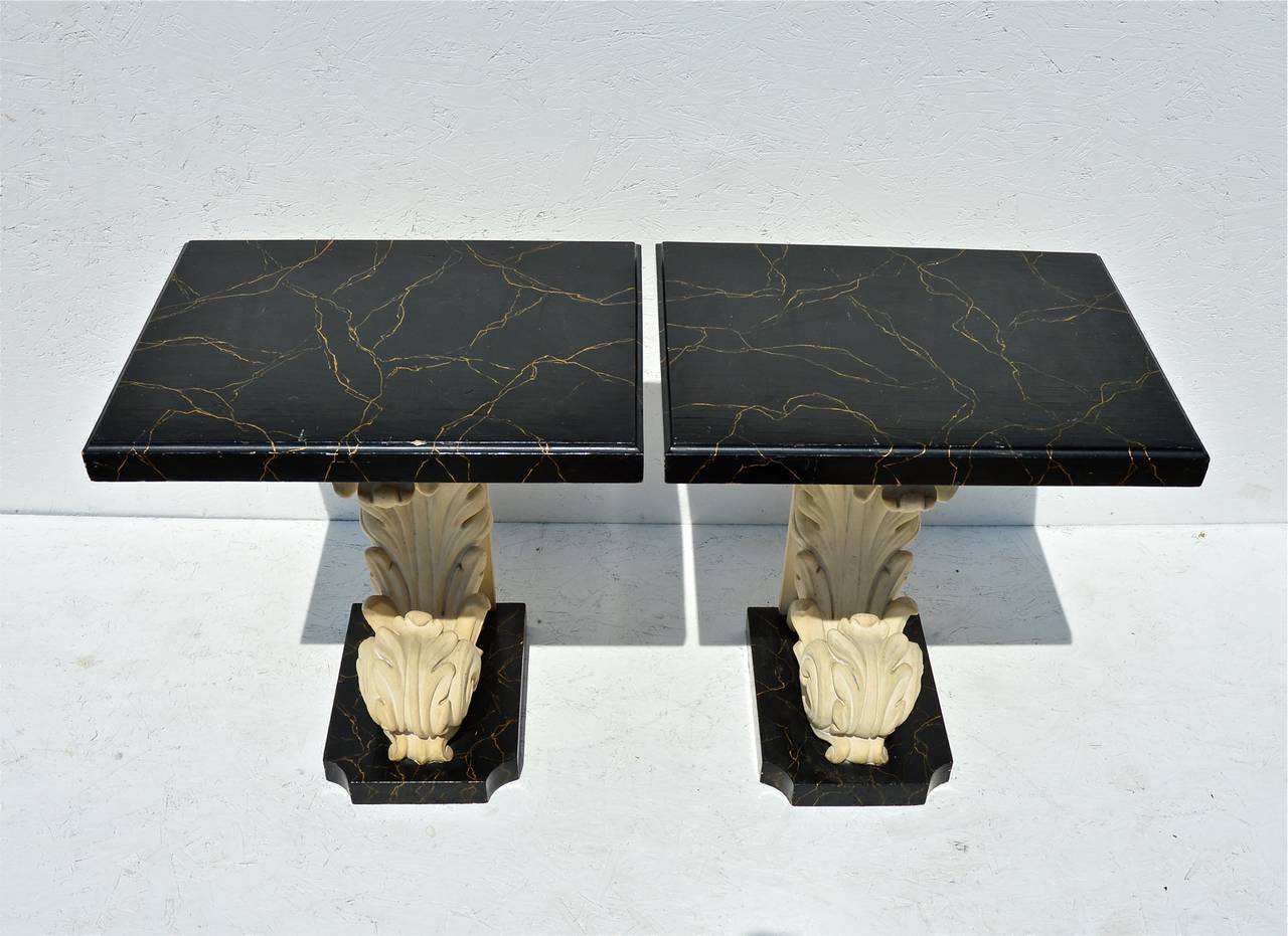 Pair of architectural end / side tables, circa 1960s in the distinct manner of esteemed Grosfeld House, having fantastic faux-marble tops with simple yet realistic veining that rest atop resin cast corbels. Below, are ogee-edged custom cut bases