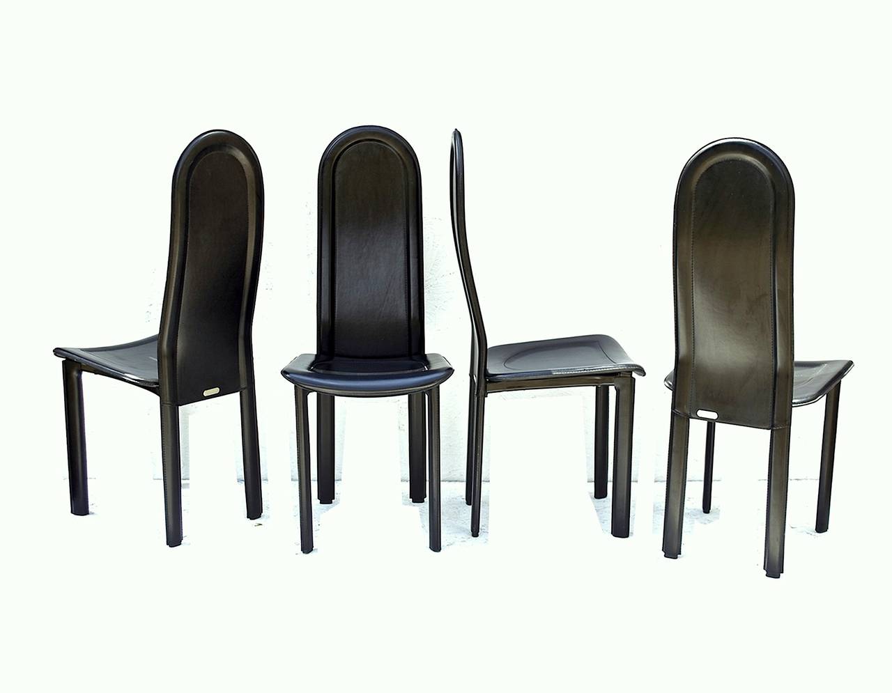 Set of black leather dining chairs by Artedi UK. These eye-catching sculptural dining chairs supply ample comfort and aggressive styling’s that define the very nature of 20th century furniture design. The quad of chairs were part of a Maxwell House