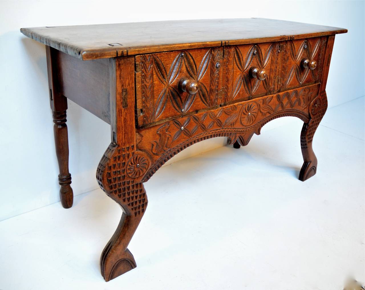 Late 19th century Central American hall table or console. This highly stylized table is most commonly referred to as a Nahuala (animal spirit) table and is specific to certain regions of Central America. The single board rectangular top rest upon