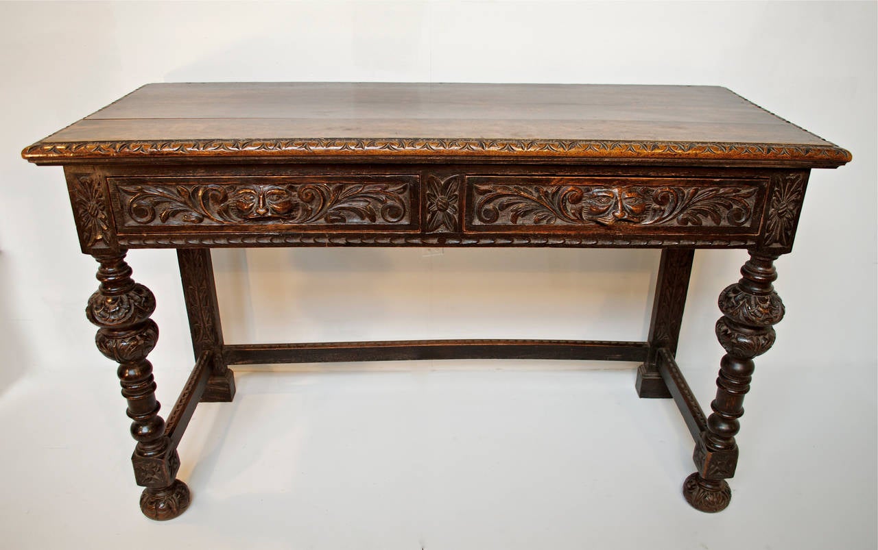 Hall console table of oak in the Renaissance Revival taste by  J.A. Shoolbred & Co. Shoolbred was a draper in 1822 and through his innovative and high quality furniture designs, he and his ever expanding firm went on to create and build what was to