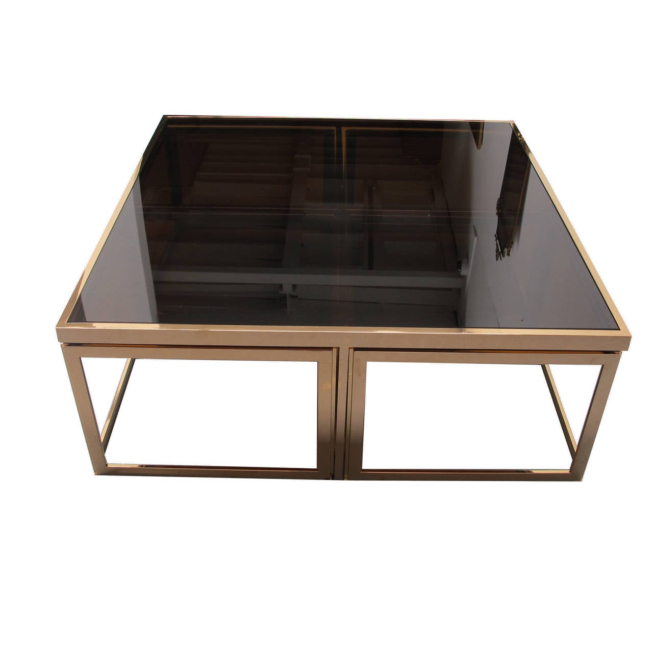 Large modular coffee table with a rose gold gold metal frame and smoked glass.