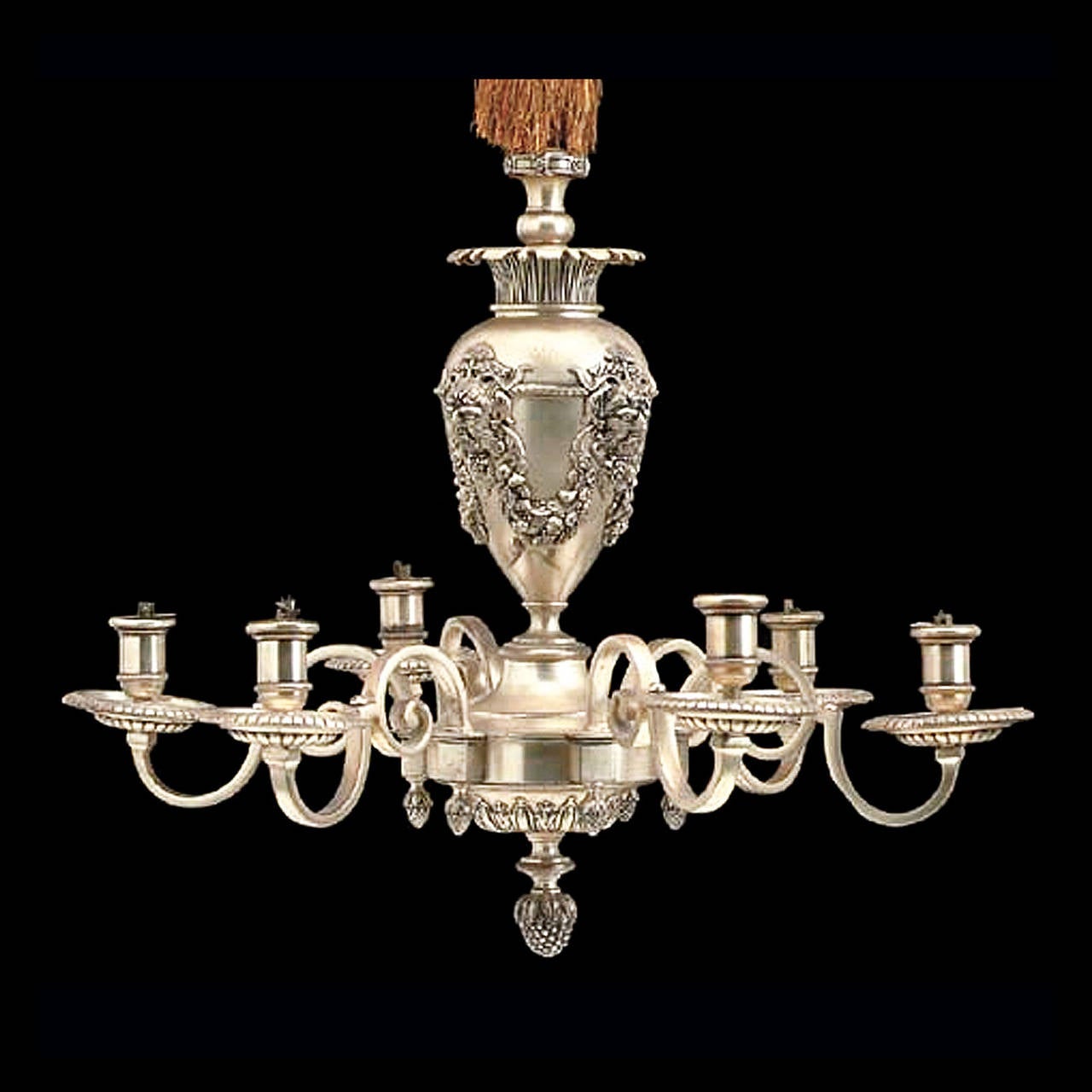 An American Neoclassic Style Silvered-Metal Six-Light Chandelier attributed to Caldwell & Co. 

Modeled as a baluster vase suspended from a tassle, cast with satyr masks and above a berried finial, electrified
Attributed to Edward F. Caldwell &