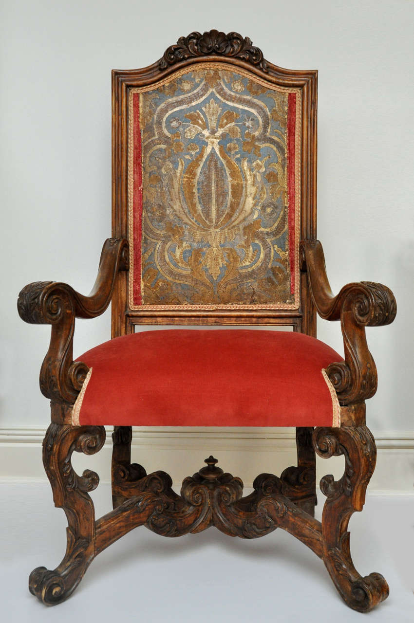 Baroque leather armchair features carved walnut, red velvet, suede and period painted leather.