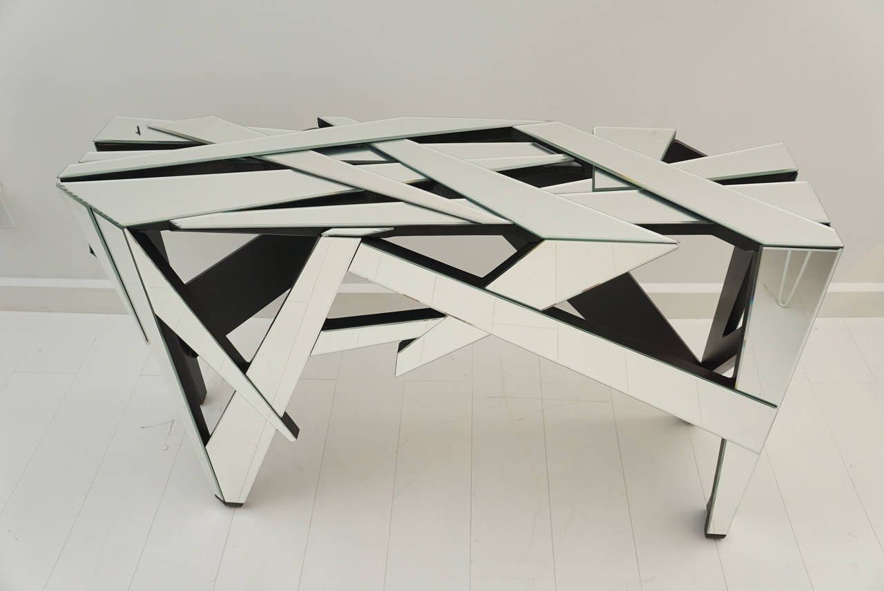 Mirrored sections assembled in abstract patterns create this one-of-a-kind console.