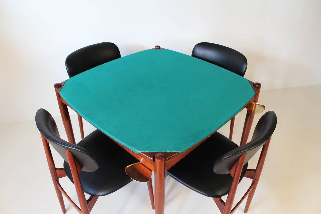 The most famous poker table in the world, designed by Gio Ponti and produced by the Fratelli Reguitti in the 1960s. The top can be reversed to either a velvet or wooden top and playing cards can be stored underneath.
On each corner brass ashtrays