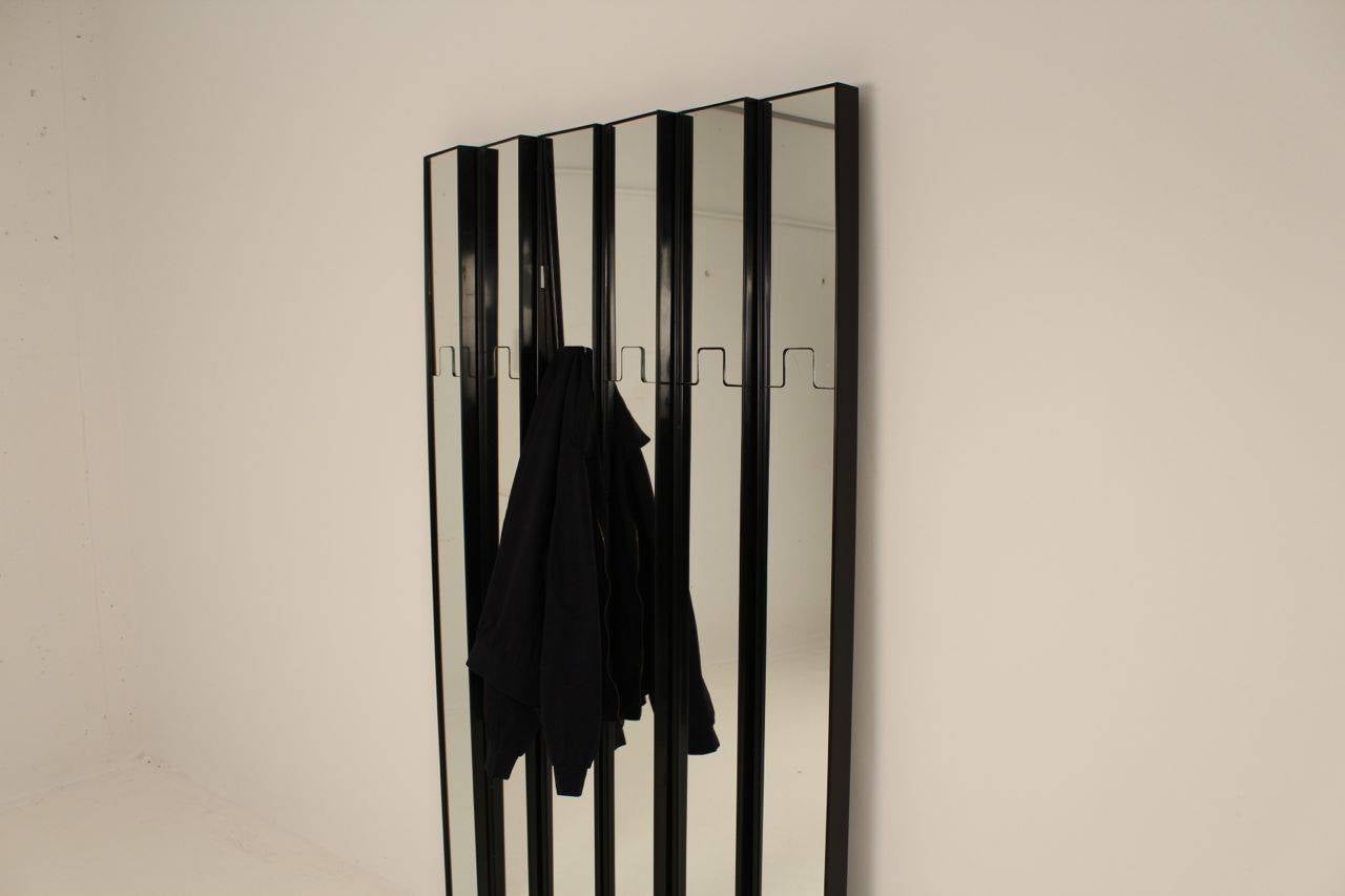 Gronda Mid Century Modern Coat Rack and Mirror by Luciano Bertoncini

5 plus one  Gronda wall-mounted coat hangers or mirrors by Luciano Bertoncini (b1939). Produced by Elco (Art Director: Joe Colombo) with spring loaded mirrors turning the mirrors