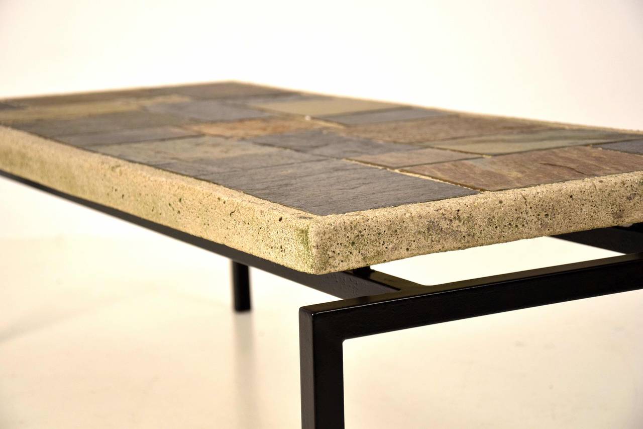 Very nice slate stone coffee table from the Netherlands in the style of Paul Kingma. 

The top is in great condition. The frame has some corrosion as can be seen in the picture.