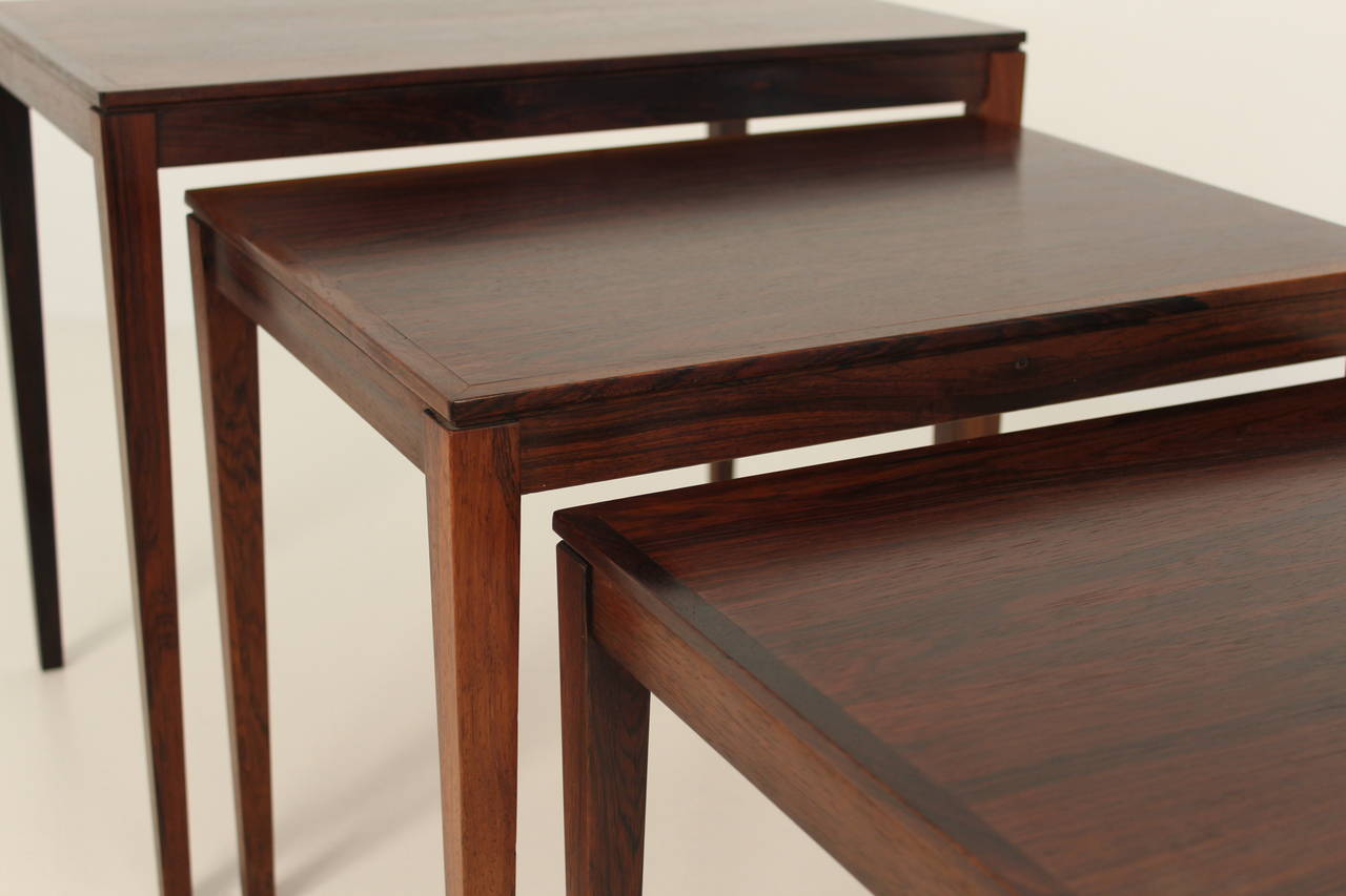 Sophisticated and elegant set of three rosewood nesting tables in the style of Severin Hansen.

Square tapered legs and overall in great condition.