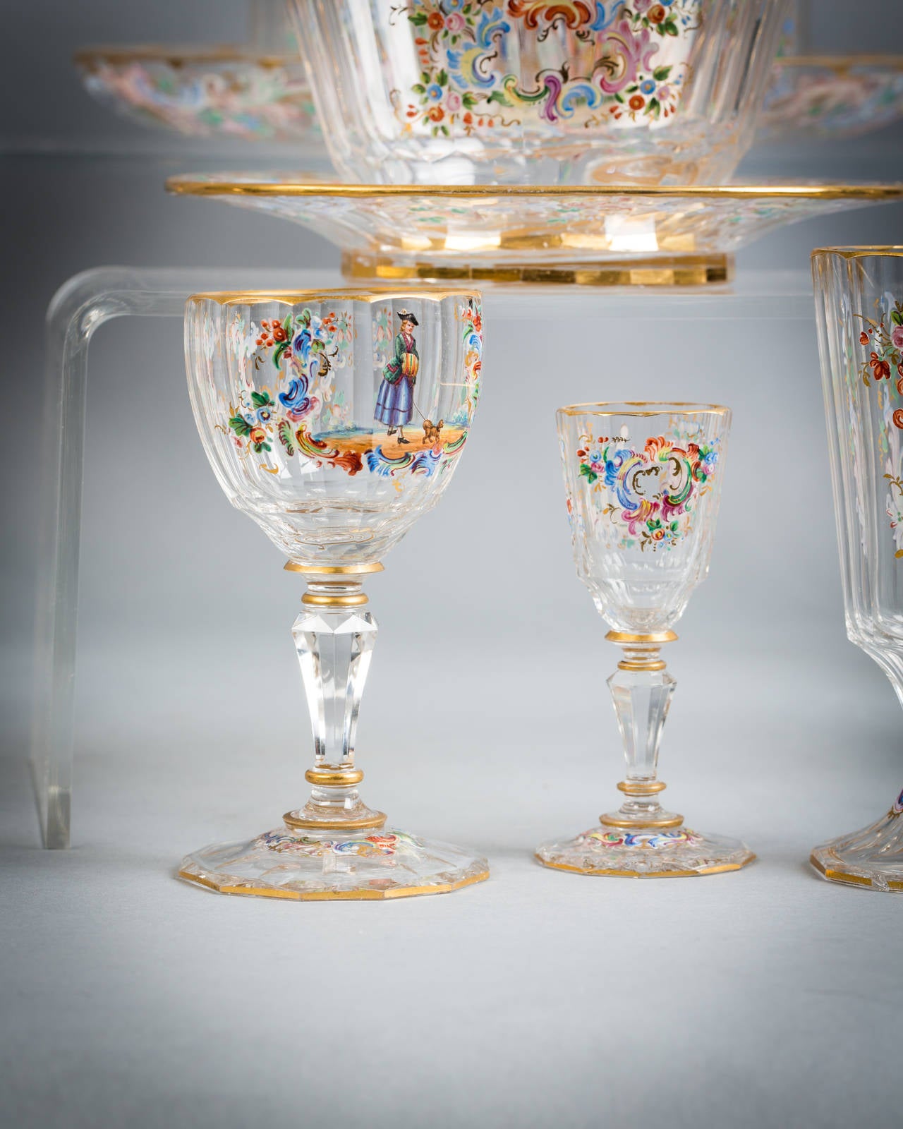 Pair of large water jugs, one smaller jug, pair of vases, decanter and stopper, liquor decanter and stopper, four liquor glasses, twelve water glasses, twelve champagne, eight wine glasses, three finger bowls and stands, tazza, set four