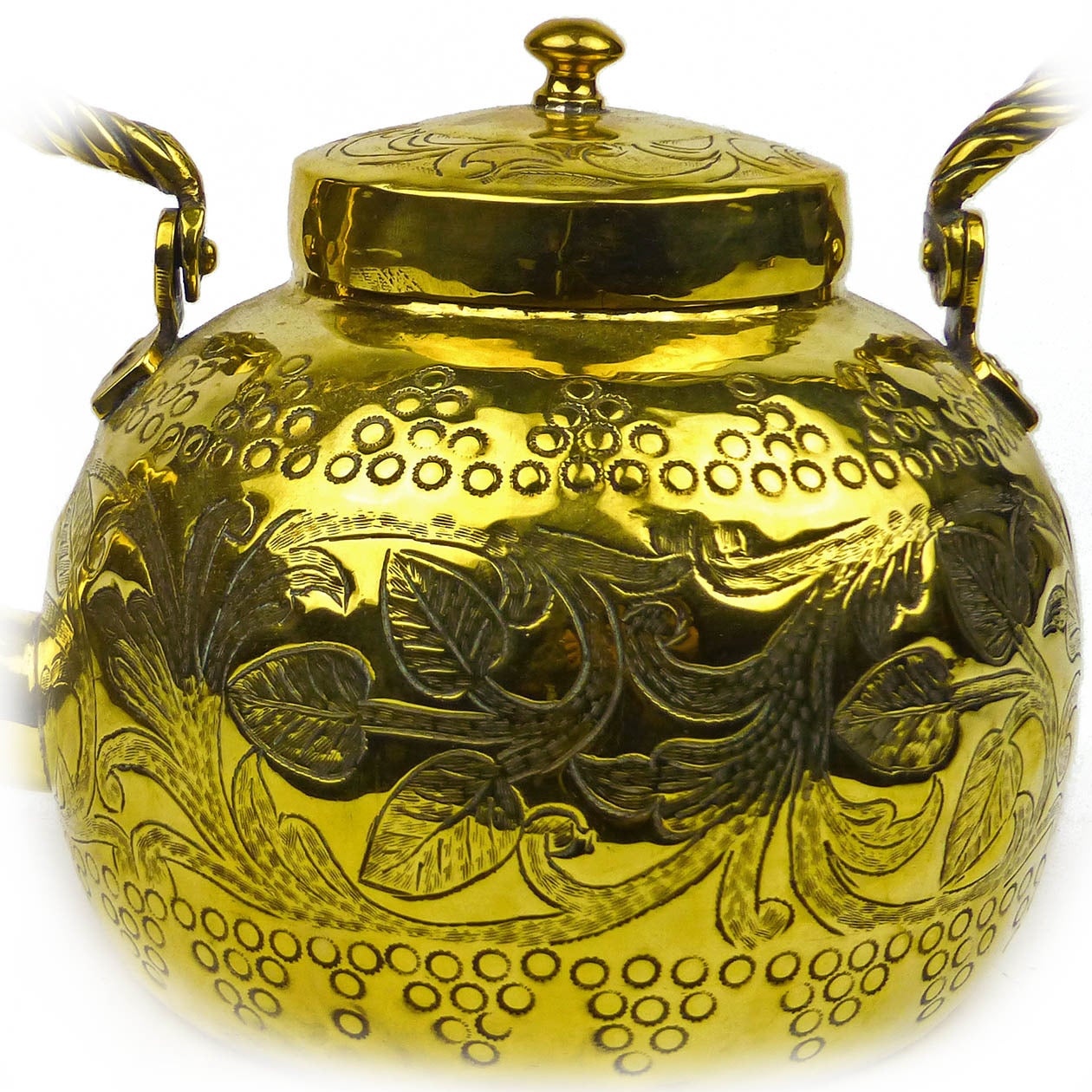 Arts and Crafts English brass tea kettle, circa 1890. With twisted swing handle. Beautifully decorated body. Measures: Height: 8 3/4″, diameter 5 1/4″.