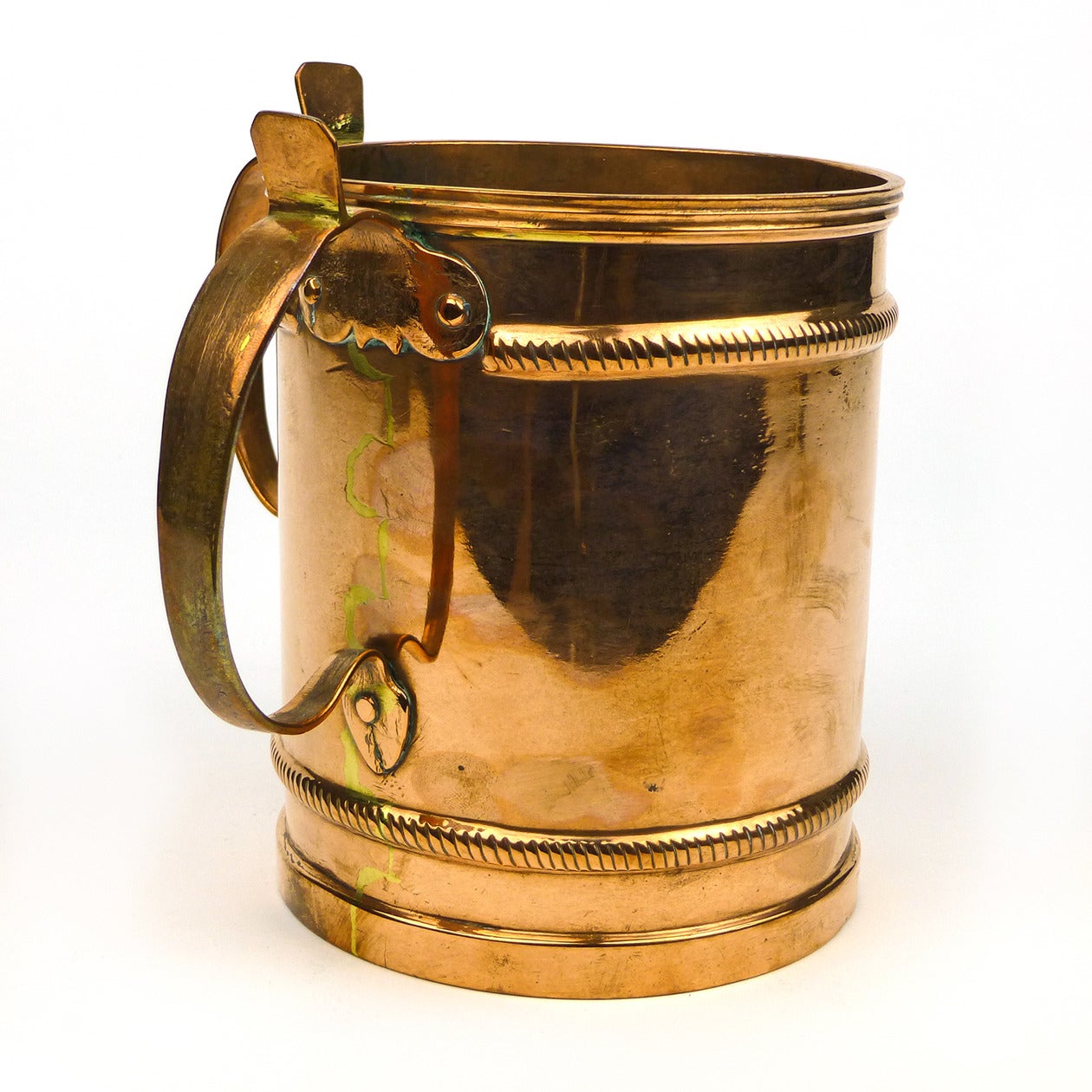 Very finely made Russian two-handled copper wash cup, circa 1850.

Judaic. Used for the ceremonial washing of hands (netilat yadayim). Unusual features include thumb piece and scalloped detail.

Measures: Height 6 3/16?, Diameter 5?.