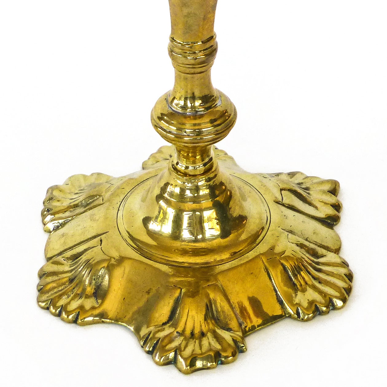 Queen Anne 18th Century English or Dutch Brass Shell Base Candlestick, circa 1750 For Sale