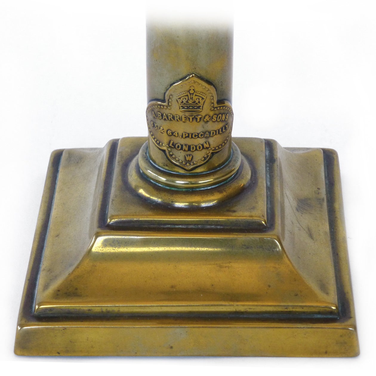 English Signed Brass Spring Loaded Candlestick, circa 1870

“A. BARRETT & SONS… 63 & 64 PICCADILLY LONDON… NO 6”