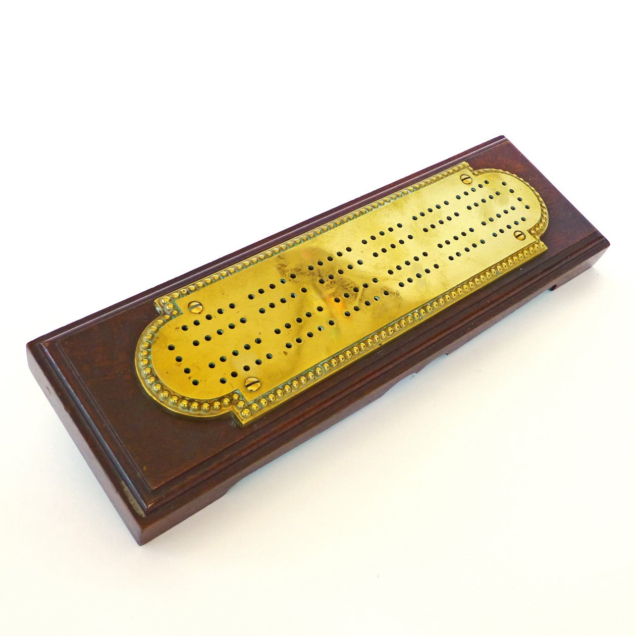 American brass and mahogany cribbage board, circa 1880.