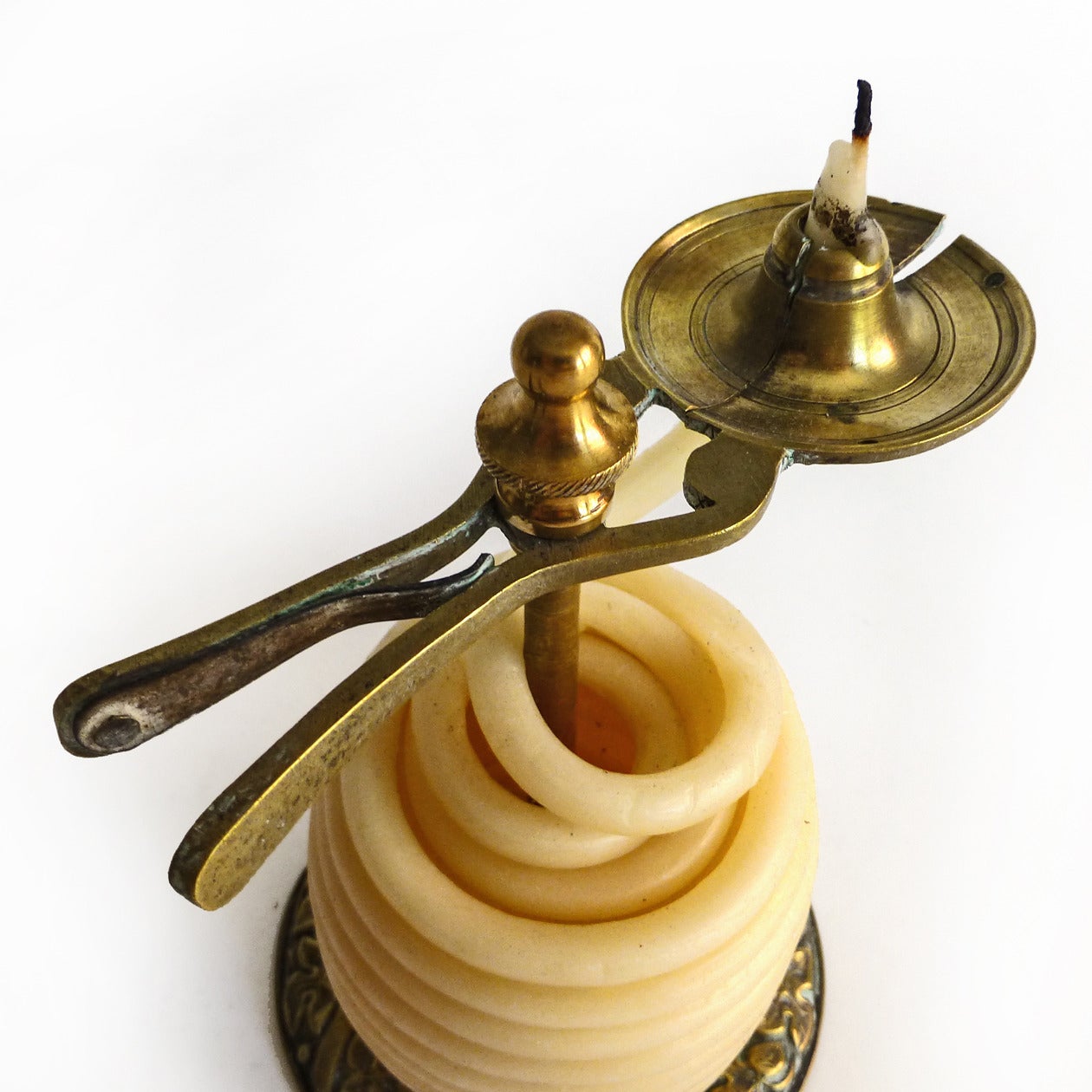 English regency brass wax Jack. Fine original condition with wax snake. Base has Repousee decoration. Working jaws, circa 1810.