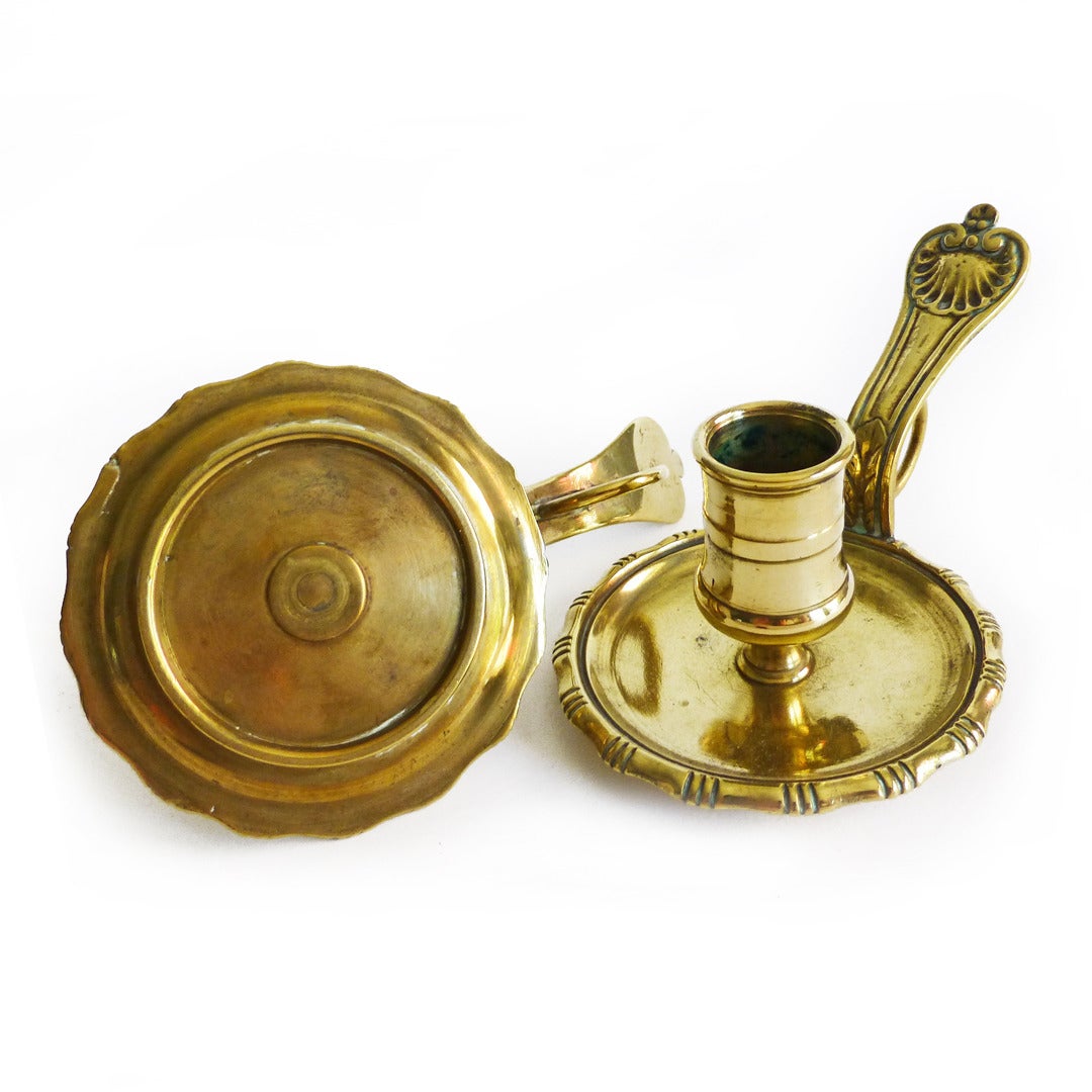 Rare pair of French brass chambersticks. Decorated edge, shell on handle, circa 1780.

Measures: Length 5 3/8”.

Height 2”.

Diameter of Base 3”.