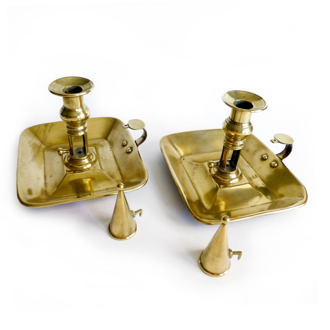 Pair of Rectangular English Brass Chambersticks. With cast sockets. Original push-ups and conical extinguishers. Circa 1820.

Height 5”

Base 6 ¼” x 7 ¼”