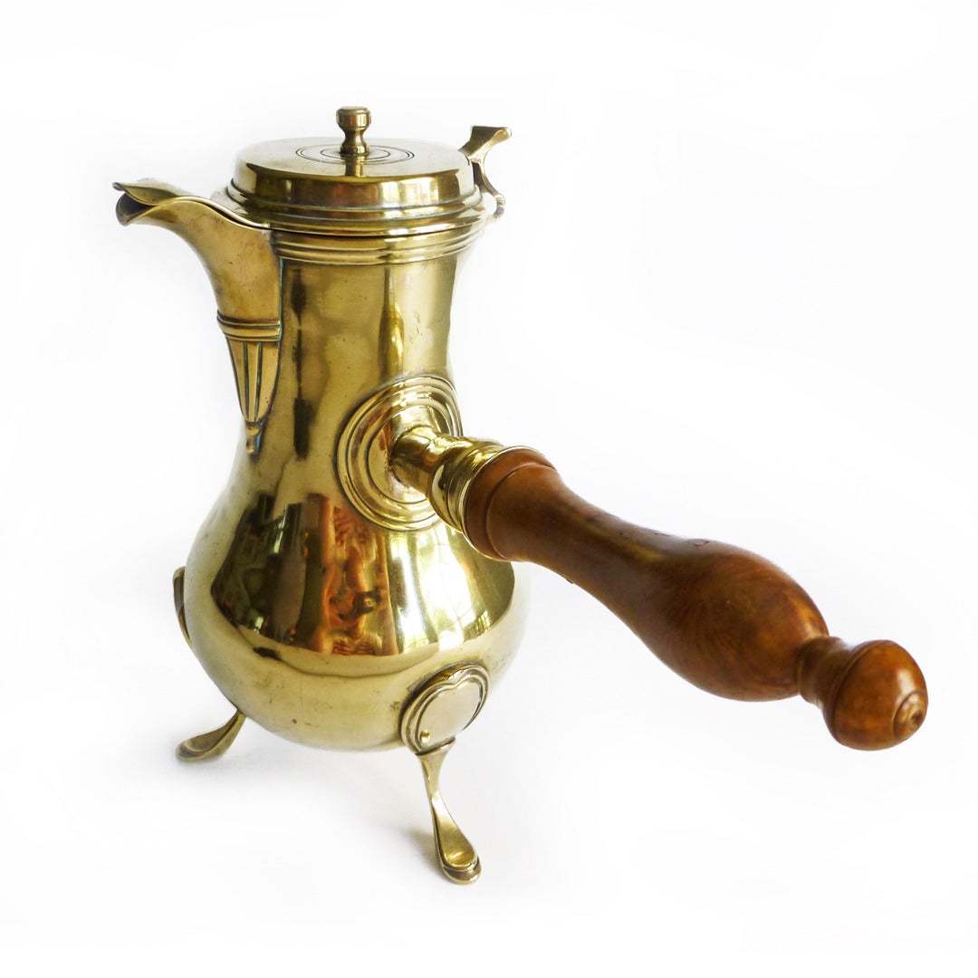 Rare French three-legged silver form brass coffee pot. Pear shaped. Original fruitwood handle. Wonderful condition, circa 1765.

Measures: Height 9 ½”.

Length 10 ¼”.

Base triangle 4 ¾”.