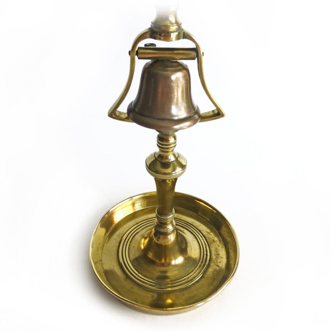 Single English Brass Tavern Candlestick with bell, circa 1820.

Height 12.5”

Base Diameter 5 7/8”