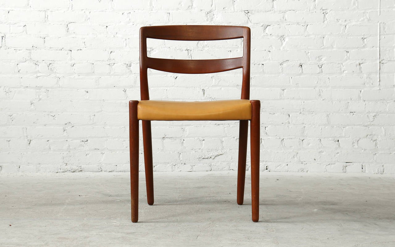 - Designed in 1952
- Solid teak frames
- Original imitation leather upholstery
- Webbing seat supports

A set of six masterfully crafted vintage teak dining chairs by Ejner Larsen & Axel Bender Madsen for legendary Danish cabinetmaker Willy