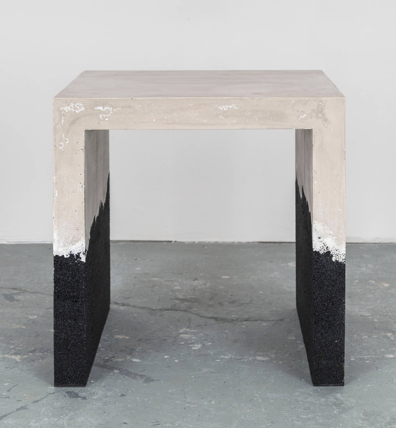This side table consists of a hand-dyed raw cement top and a black silica bottom. The cement is poured by hand over the silica, creating an organic blend between the two materials.
Custom options available, please inquire with the studio.