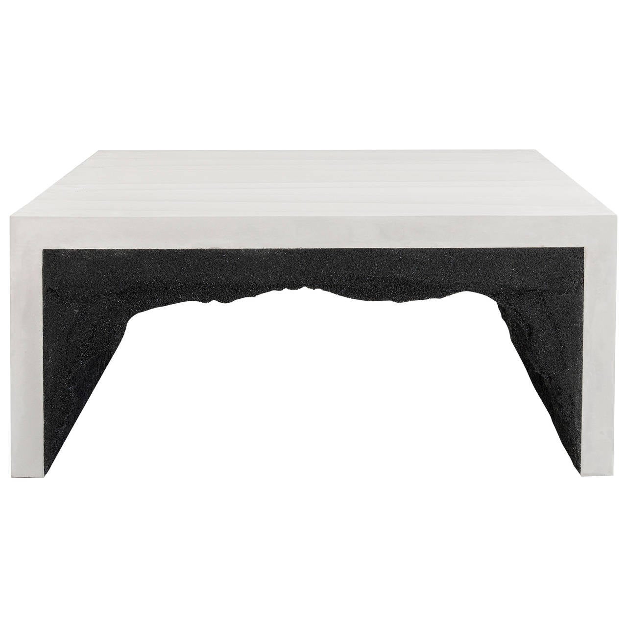 This coffee table consists of a hand-dyed white cement and a black silica interior. The silica is packed by hand within the cement in an organic nature.
Custom options available, please inquire with the studio.