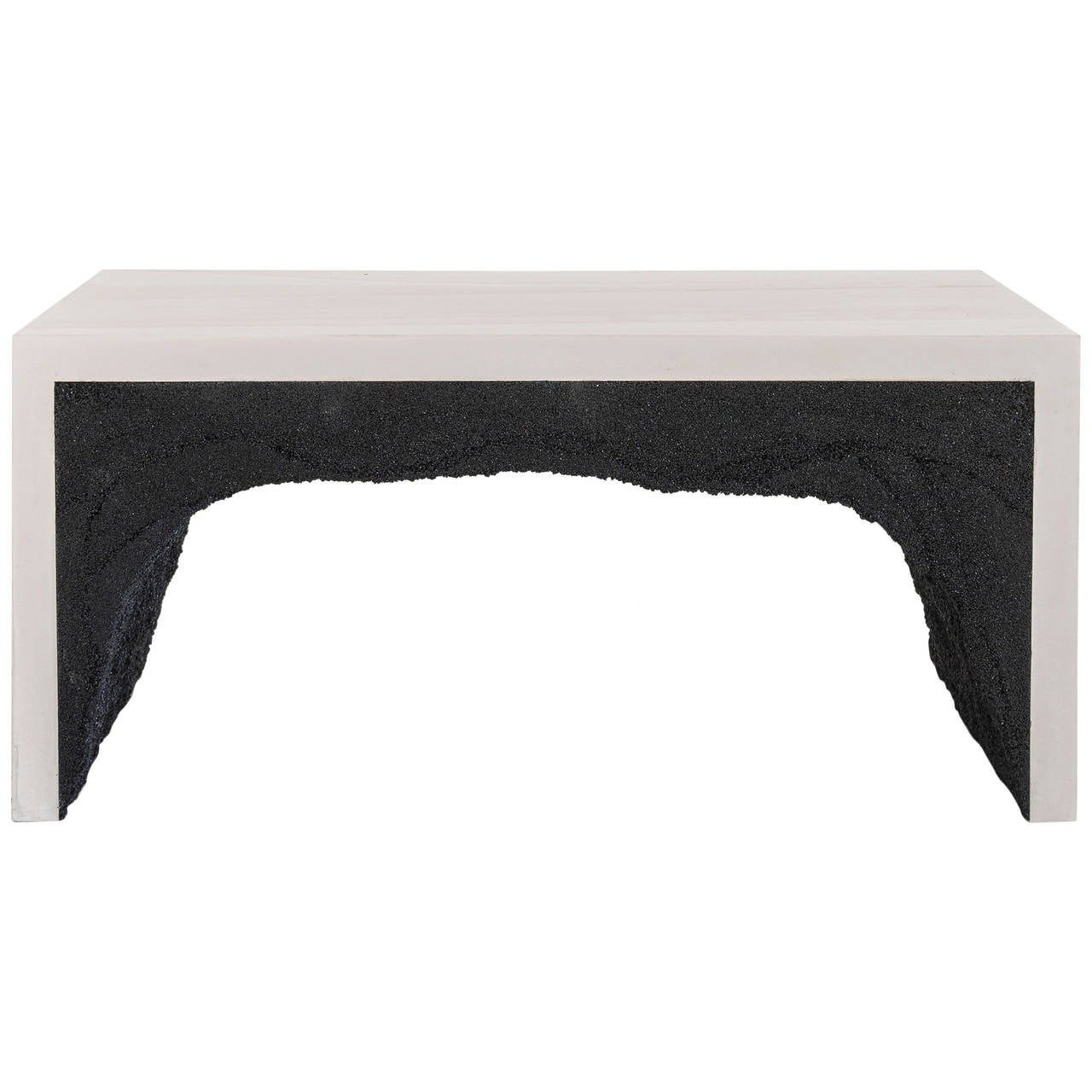 This bench consists of a hand-dyed white cement exterior and a black silica interior. The silica is packed by hand within the cement in an organic nature. 
Custom options available, please inquire with the studio.