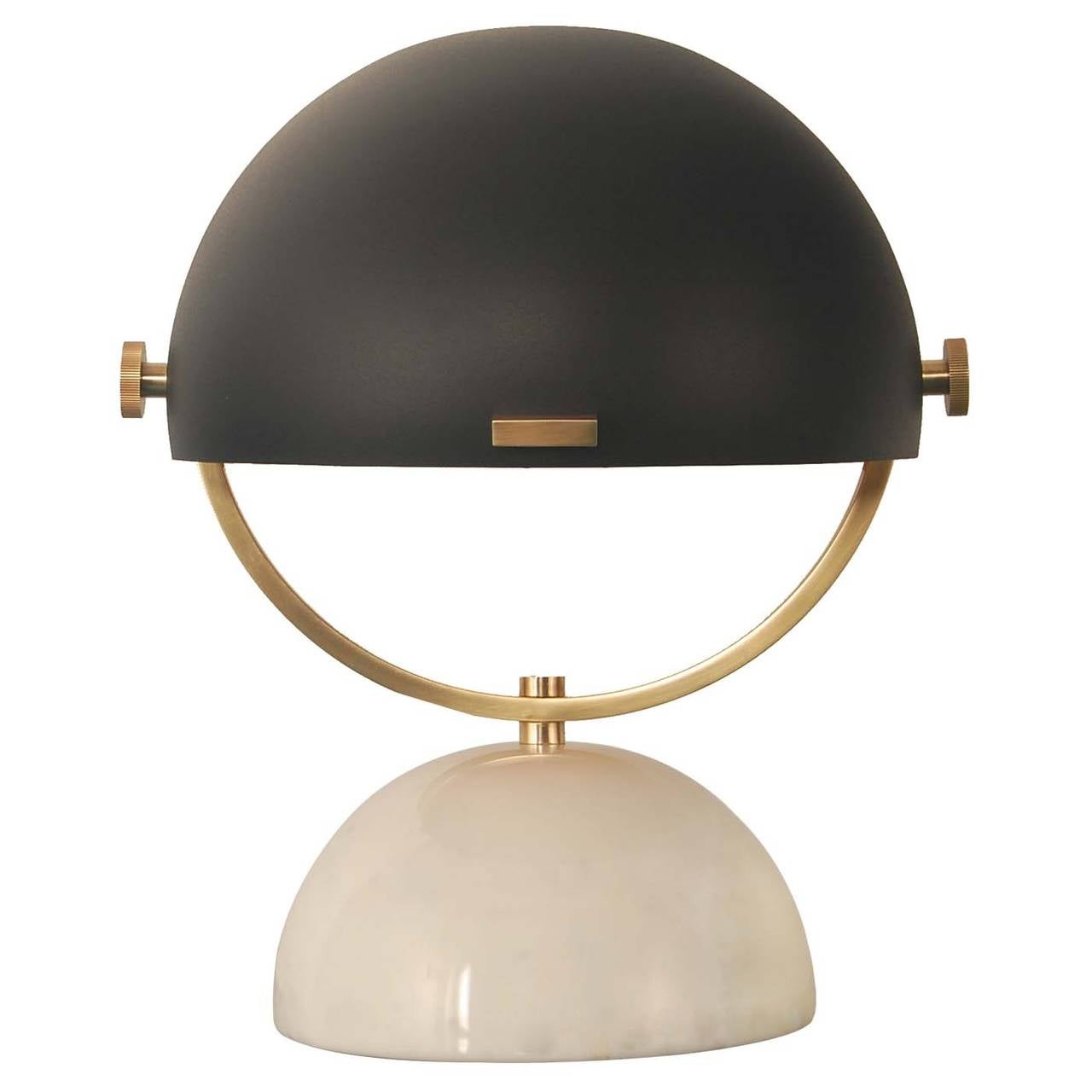 Half Sphere Desk Lamp, the mix of Materials and the functionality of this piece, makes this the ideal Accessory to any stylish Modern Home. 
Finish Shown, Aged Bronze, Antique Brass, White Stone