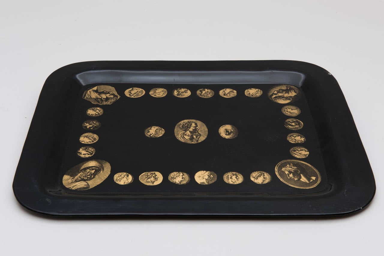 Early tray by Piero Fornasetti, gilt decoration on a black ground portraying ancient coins. This 