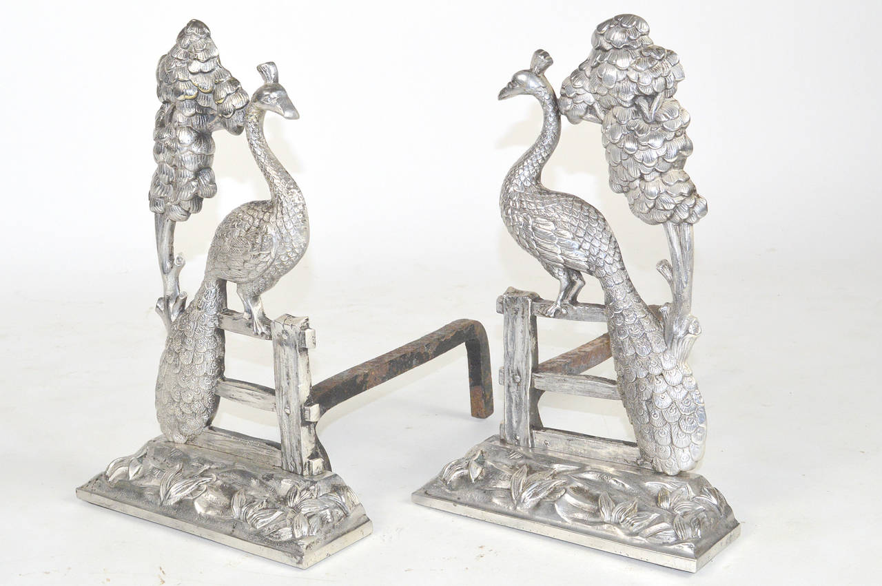 A Stunning pair of Art Nouveau Silvered Bronze Peacock Andirons.