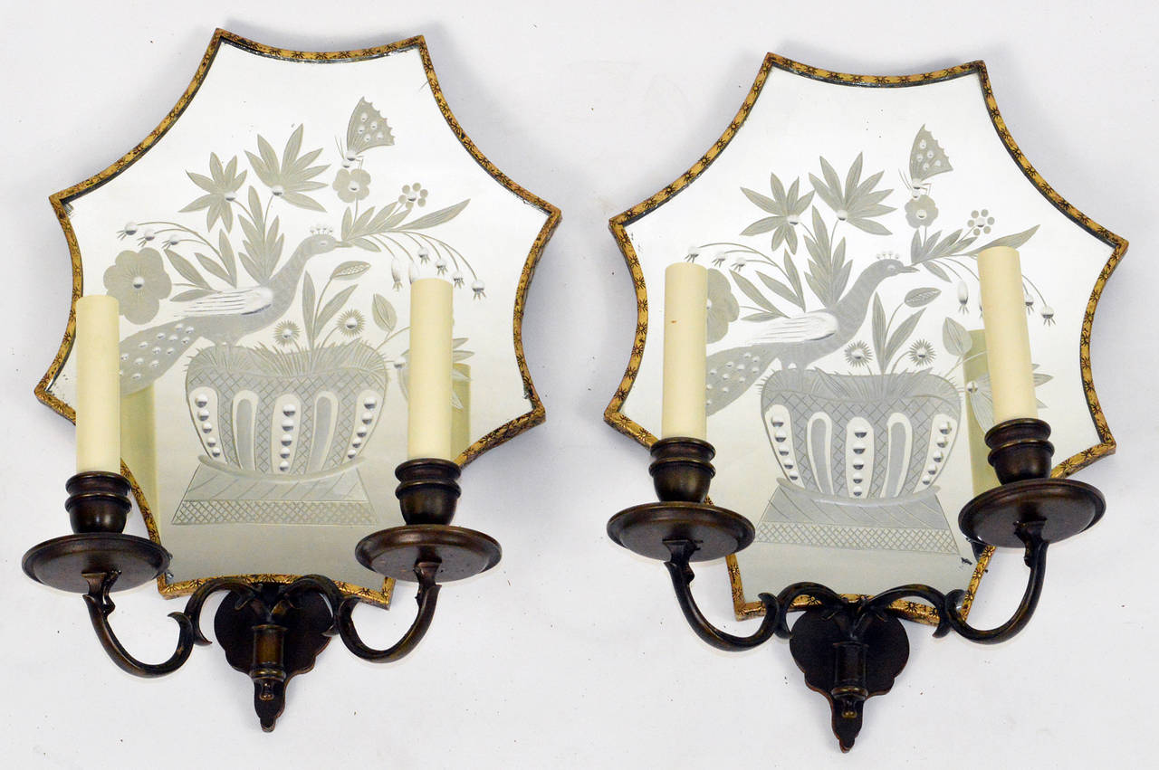A very fine set of four flower and peacock mirrored back sconces signed Caldwell, circa 1920.
