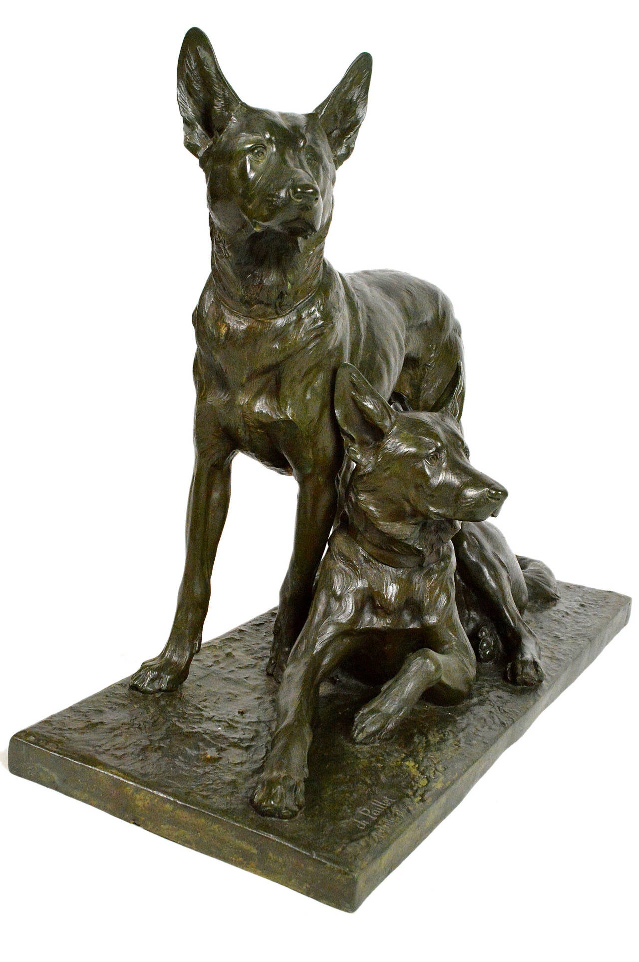 Charles Paillet (1871-1937, France) monumental patinated bronze grouping with a pair of German Shepherd dogs, one laying down and one standing. Signed 